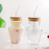 Curved ribbed glass tumbler