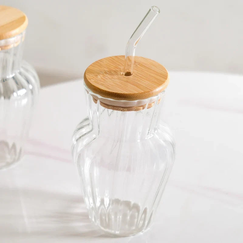 Curved ribbed glass tumbler