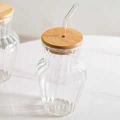 Curved ribbed glass tumbler